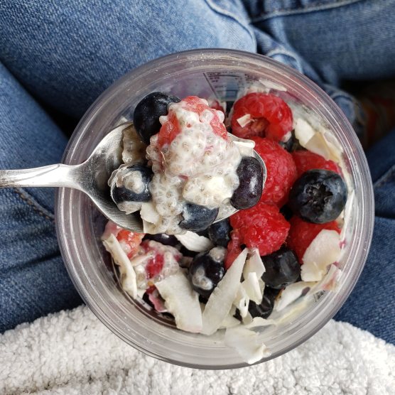 Chia pudding with coconut flakes and berries